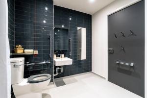 a bathroom with a toilet and a sink at The Artisan - City Centre in Dublin +26 photos
