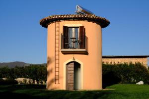 a small building with a balcony on top of it at La Maraviglia in Foligno