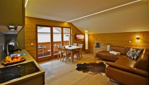a living room with a couch and a table at Villa Natur in Schröcken