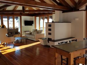a living room with a couch and a table at Apartment mit Balkon by Interhome in Padola
