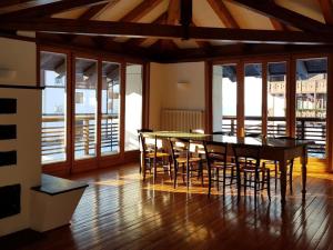 a dining room with a table and chairs at Apartment mit Balkon by Interhome in Padola