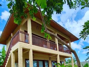 a building with a balcony on top of it at Sanur ocean view villas in Sanur
