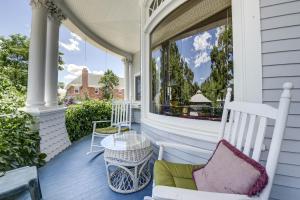 a porch with two chairs and a table at The St. Mary's Inn, Bed and Breakfast in Colorado Springs