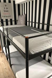 a black and white bunk bed in a room at Apartment Tami by Interhome in Wervershoof +15 photos