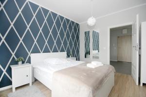 Łóżko lub łóżka w pokoju w obiekcie Livin Premium Apartments