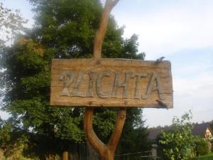 a wooden sign that says natal on it at Apartment by Interhome in Łukta