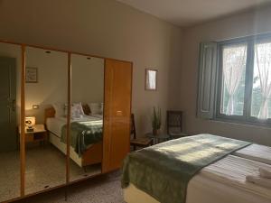a bedroom with a bed and a dresser at il nuvoloso in Città della Pieve