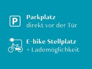 a picture of a bike with the text nor der tram e bike at Casa Ueberall - Ruhige DG-Ferienwohnung für 2 Erwachsene in Burg - Balkon mit Abendsonne, hochwertige Ausstattung, überdachter E-Bike-Stellplatz, Nähe zur Altstadt & Restaurants in Fehmarn +44 photos