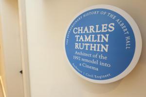 a blue and white sign on a wall at The Swansea Central Hall 1 Bed Room Apartment in Swansea