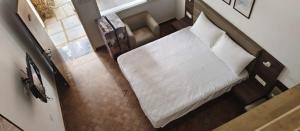 an overhead view of a bed in a room at Le Aham Boutique Hotel in Kuilapayam