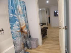 a hallway with a door open to a hallway with a room with a hallway at Small comfortable apartment in Saint-Nazaire