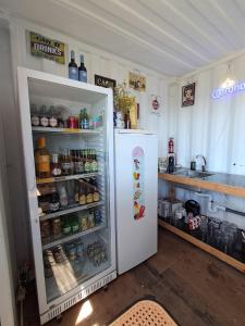 a refrigerator with its door open in a kitchen at Monkey Tiny Barnhouse with amazing views at ZevariClub! in Folhadosa +102 photos
