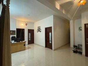an empty room with a lobby with a desk at Seven Peak Hostel in Chikmagalūr