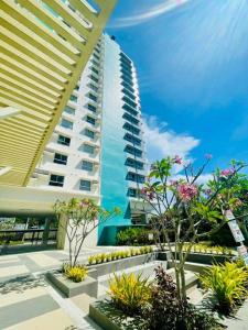 a tall building with some plants in front of it at Ona's Condo in Bacolod