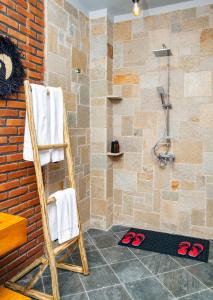 a bathroom with a towel rack and a shower at Zondela House in Nkoanrua +56 photos