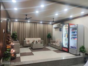 a store with a soda machine in a room at Hotel Heaven Blu in Hodal