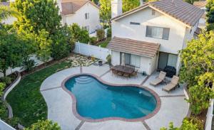 an overhead view of a backyard with a swimming pool at Luxe 2-Story Oasis with Private Pool & Backyard in Laguna Niguel