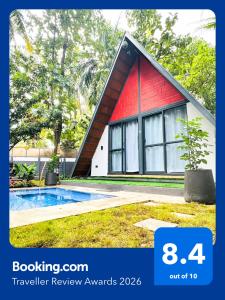 a red and white house with a swimming pool at Oh - Bali Villa by Travent Mug in Rāmanagaram