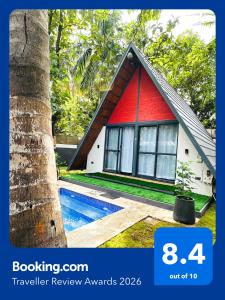 a red and white house with a swimming pool next to a tree at Oh - Bali Villa by Travent Mug in Rāmanagaram +18 photos