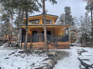 a log cabin in the woods in the snow at Chalet neuf proche des stations de ski in Saint-Pons
