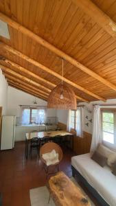 a living room with a couch and a table at Cabañas Parque Almendro in San José de Maipo