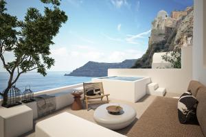 a living room with a view of the ocean at You and Me Suites Oia in Oia