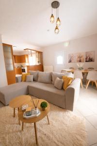 a living room with a couch and a table at Konitsa Horizon Villa in Konitsa