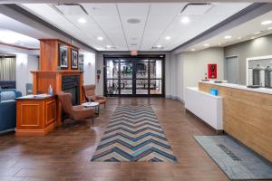 a lobby of a hospital with a waiting room at Newly Renovated Hampton Inn Omaha West Lakeside in Lane +31 photos