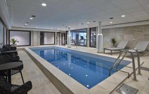 a large swimming pool in a hotel room at Scandic Luleå in Luleå