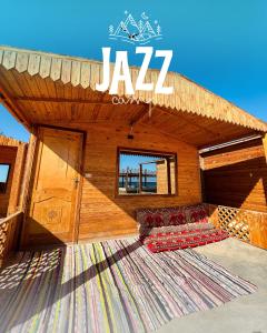a pavilion with two couches sitting on a rug at Jazz Nuwibaa Camp in Wāsiţ