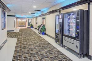 a hallway with a vending machine in a building at Capital O Duncanville Tx in Duncanville
