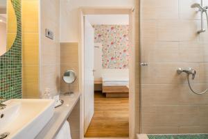 a bathroom with a shower and a sink at Hotel Erbprinzenhof in Karlsruhe +56 photos