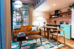 a living room with a couch and a table at Lahepere Villa mini-villad in Kloogaranna +46 photos