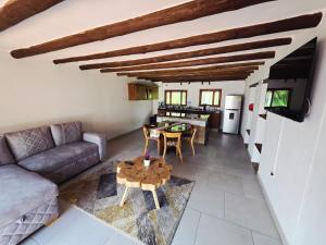 a living room with a couch and a table at Casa Hotel La Morada in Villa de Leyva