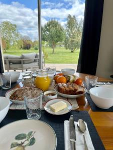 a table topped with plates of food on a table at L Ecrin d Anabelle in Saint-Georges-lès-Baillargeaux +11 photos