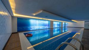 a swimming pool in the middle of a house at Grand Makel Hotel Topkapi in Istanbul