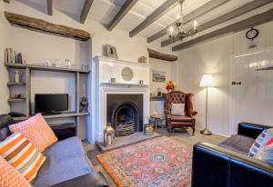 a living room with a couch and a fireplace at 2 Bed in Hawes oc-ds042a in Hawes