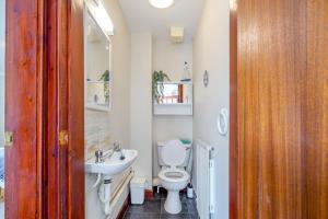 a bathroom with a white toilet and a sink at 3 Bed in Kingsbarns oc-k30925 in Kingsbarns +21 photos
