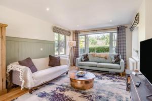 a living room with a couch and a table at 3 Bed in Cley oc-t32433 in Cley next the Sea