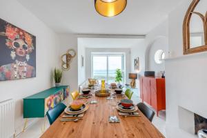 a dining room with a wooden table and chairs at 4 Bed in Saltdean oc-a32366 in Saltdean