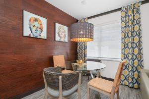 a dining room with a table and chairs at Metropole Suites South Beach in Miami Beach