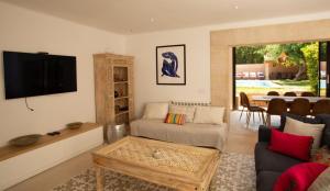 a living room with a couch and a table at Mallorca Soller Port Villa High end Balearics in Port de Soller