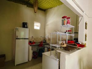 a kitchen with two refrigerators and a refrigerator at Colombia Hostel in Porto Seguro