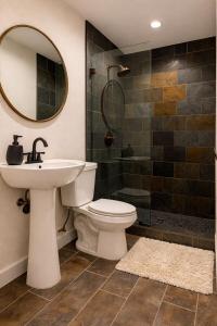 a bathroom with a toilet and a sink and a shower at Lisboa Shores in Miami