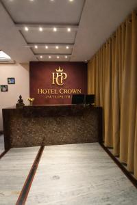 a hotel room with a sign on the wall at Hotel Crown Patliputra in Patna