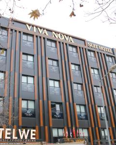 a building with the words viva nova on it at Viva Nova Suit Hotel in Bakanlıklar