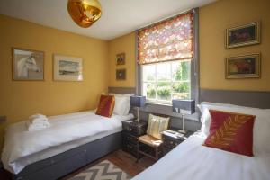 a bedroom with two beds and a window at 2 Bed in Bath oc-bhr35 in Bath