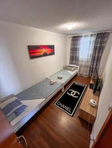 a small room with a bed and a table at Beautiful duplex apartment with view in Kaštela