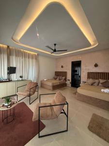 a large living room with two beds and a couch at Ceylan trees in Kataragama