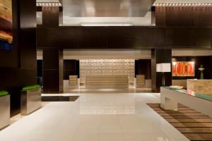 a lobby of a hotel with a waiting room at Loews Atlanta Hotel in Atlanta